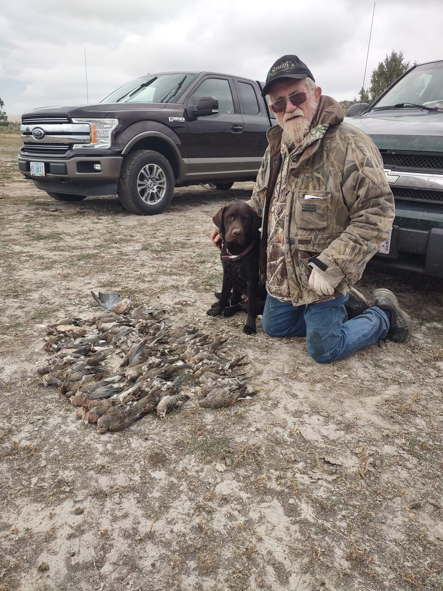 Jim with one of his Labradors after a dove hunt — eastern Oregon